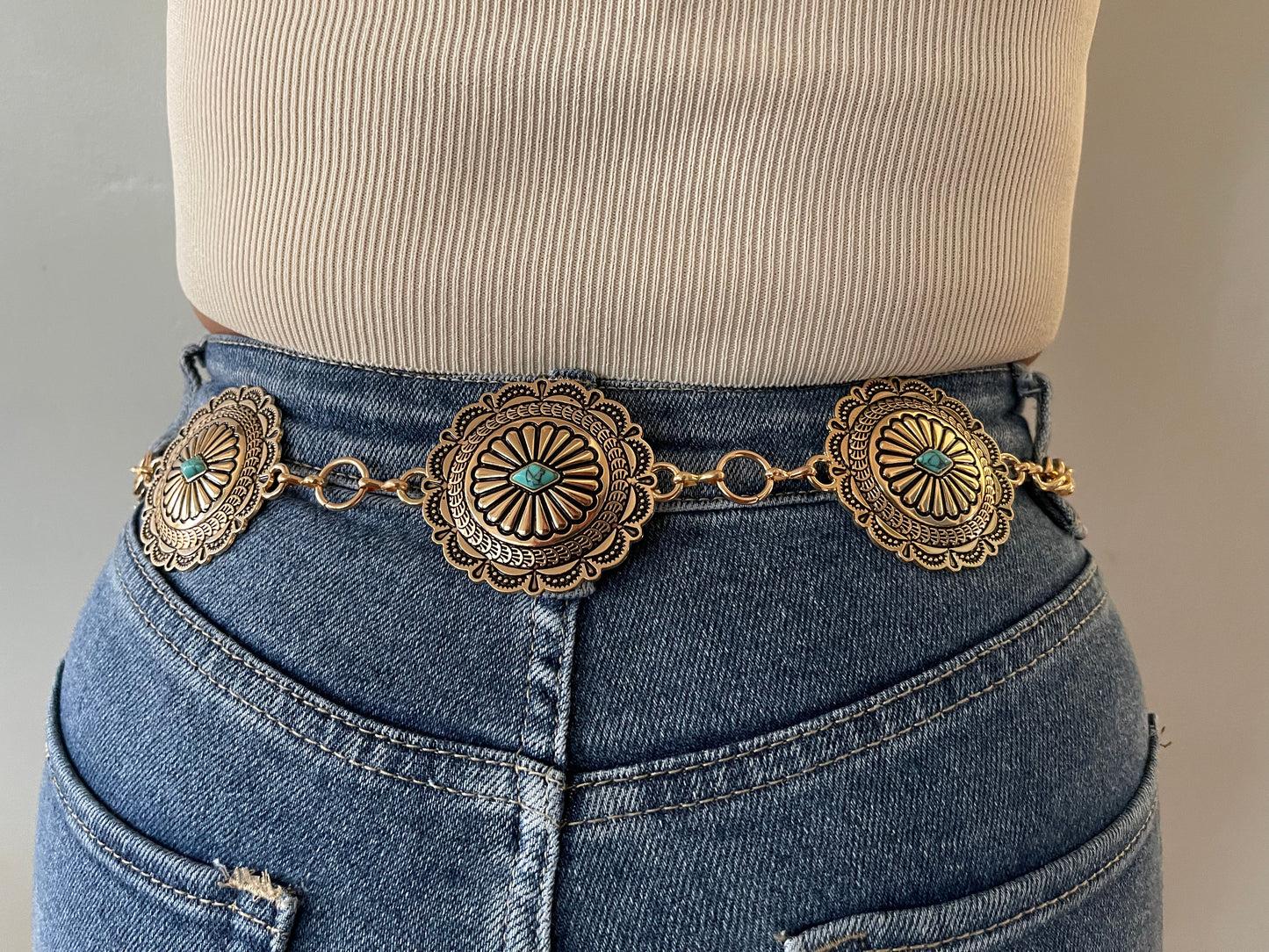 Multiple conchos with turquoise stones