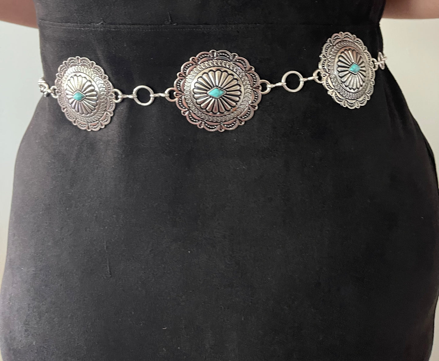 Multiple conchos with turquoise stones