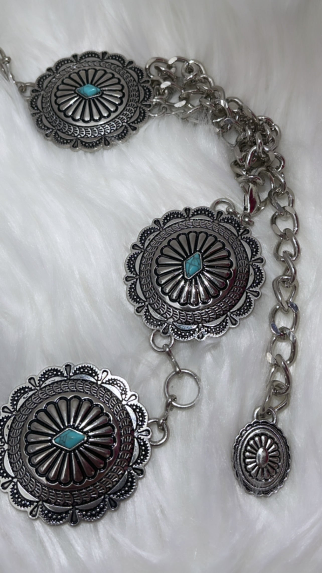 Multiple conchos with turquoise stones